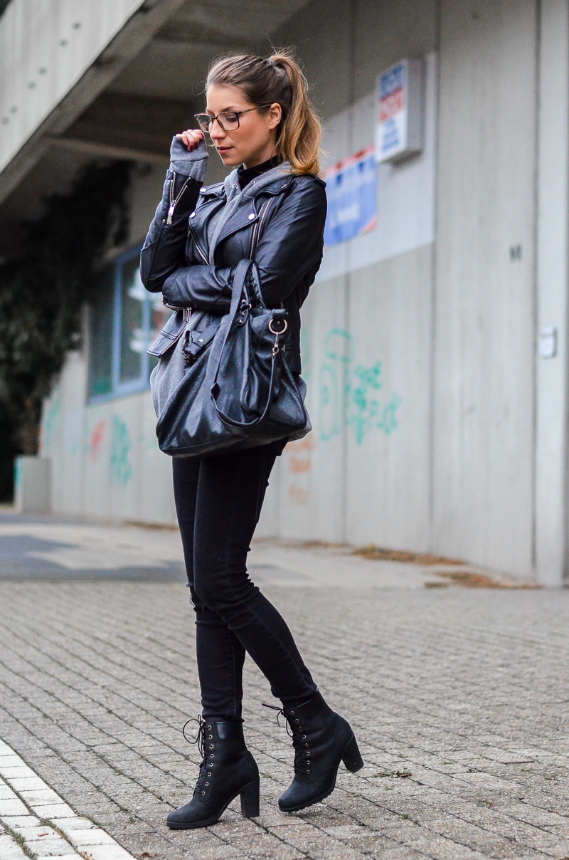 street style lederjacke hoodie schwarze jeans gucci brille outfit