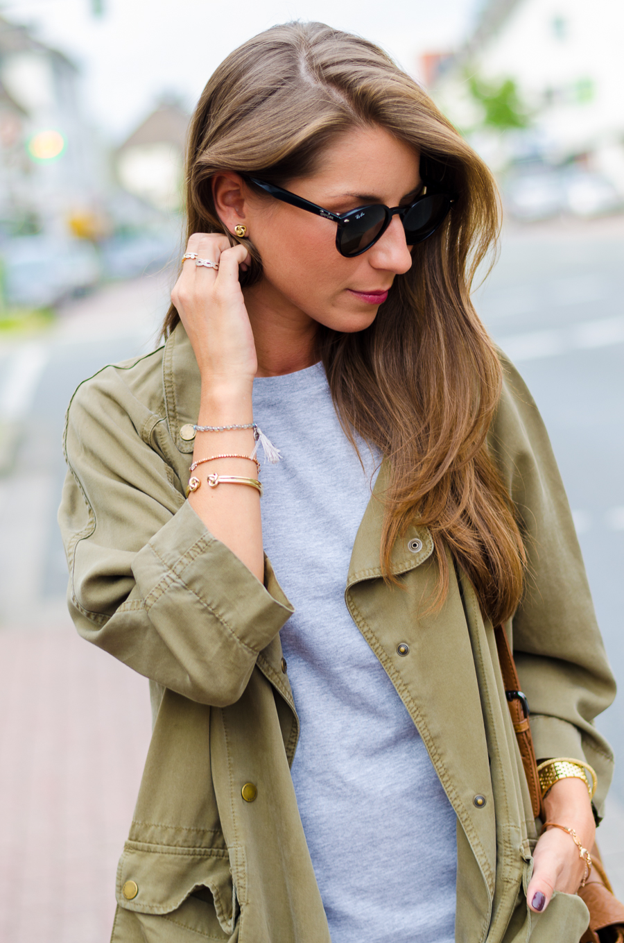 military jacket and a ruffled silk skirt outfit