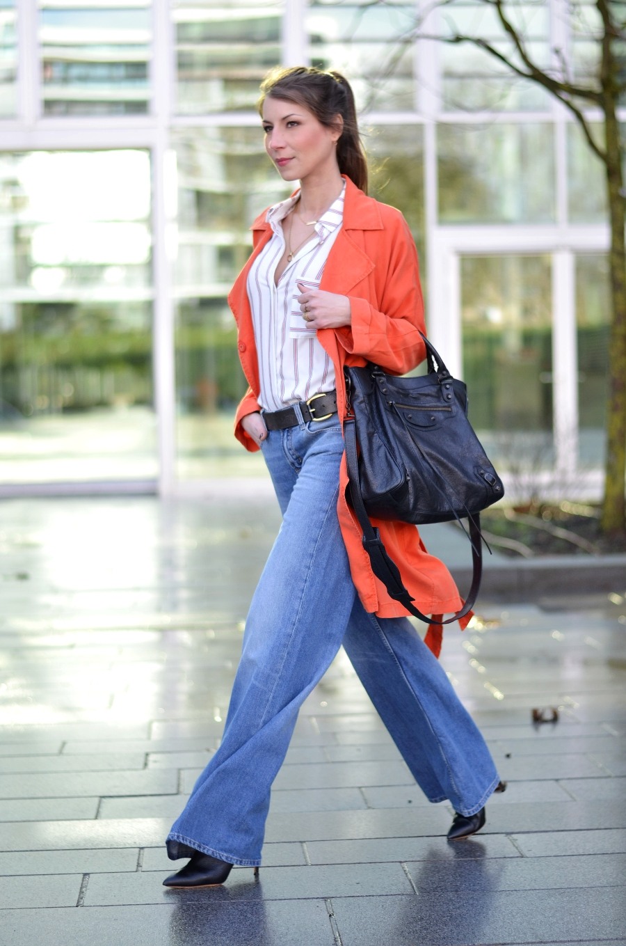 wide leg jeans orange trench coat striped shirt balenciaga giant