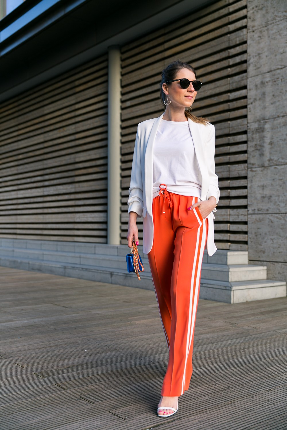 track pants stripes orange outfit white blazer heels fashion blog street style veja du