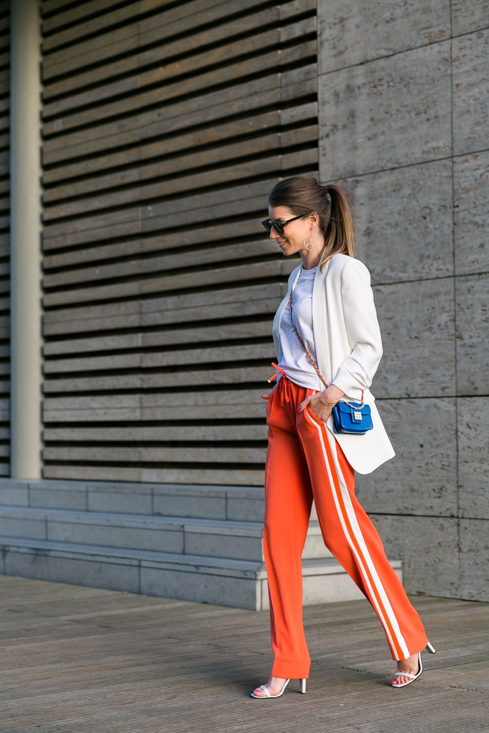 track pants stripes orange outfit white blazer heels fashion blog street style veja du