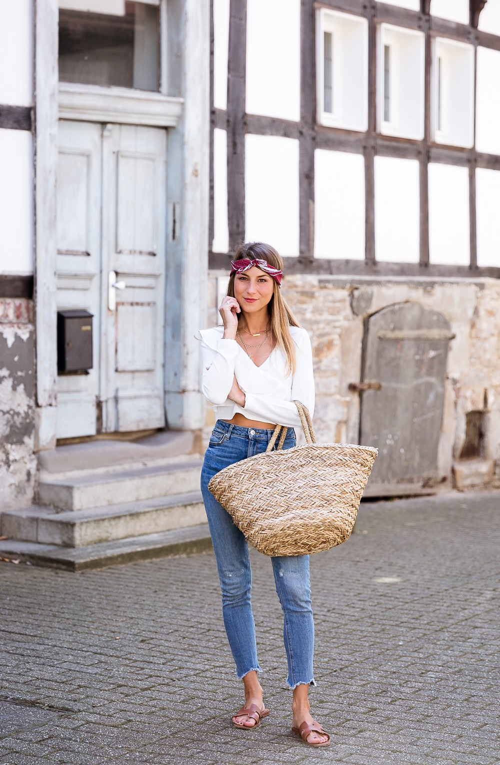 straw bag bandana hair band casual summer outfit jeans white ruffle top hermes oran sandals modeblog streetstyle inspiration